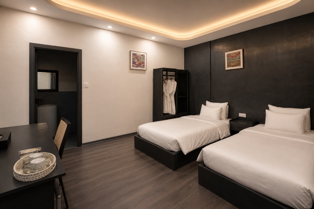 Standard Room — twin beds, work desk and wardrobe
